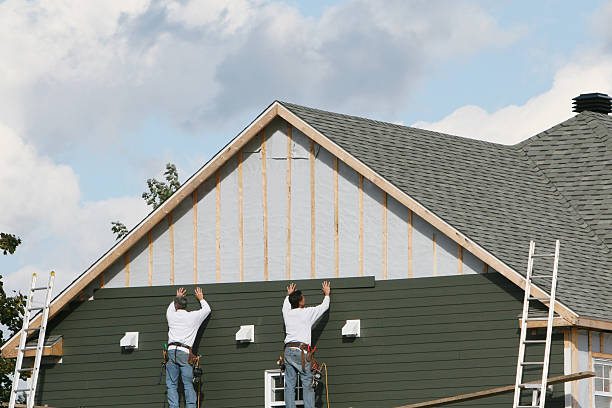 Professional Storm Damage Siding Repair technician working in Barton, OH